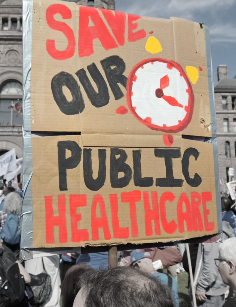 Protest sign at Queen's Park that says "Save our Public Healthcare"