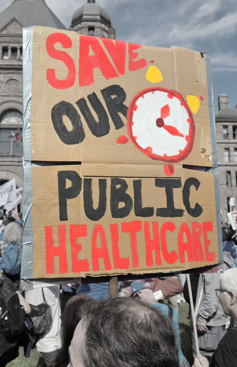 Protest sign at Queen's Park that says "Save our Public Healthcare"